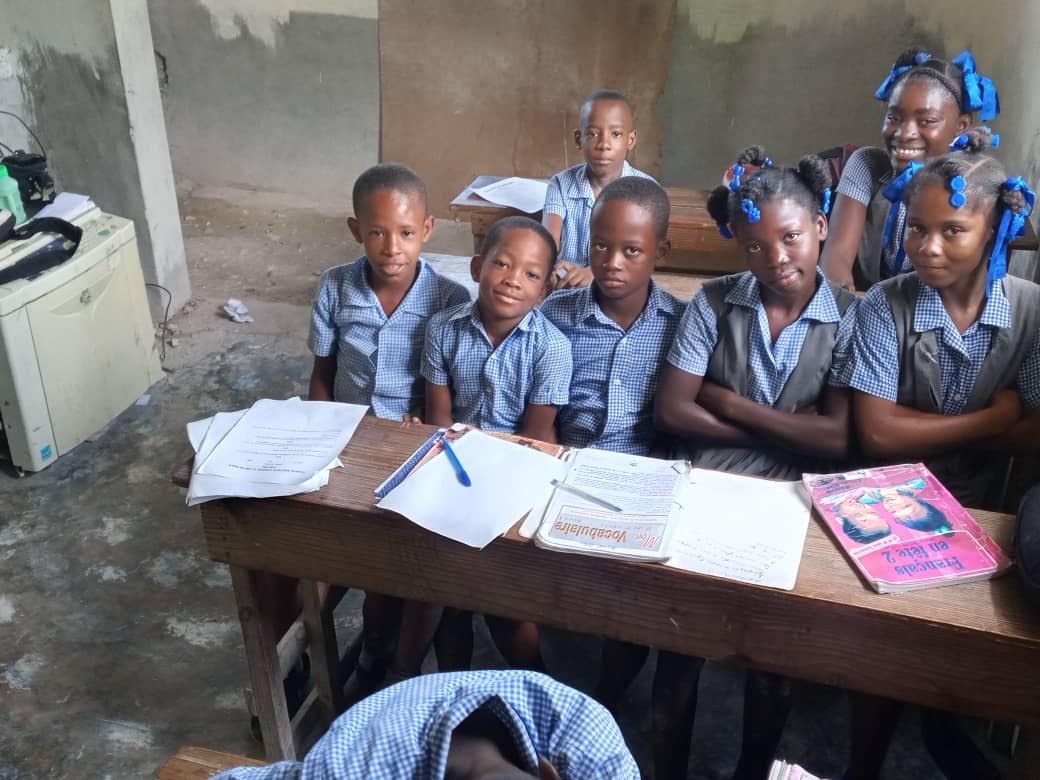 Students working together at classroom desks