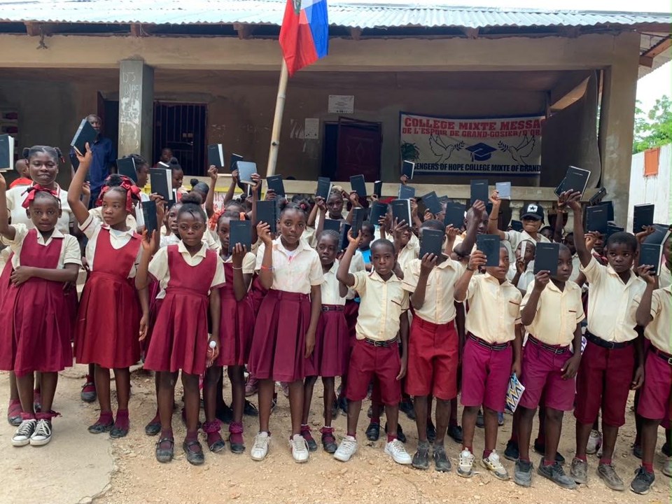 Students and teachers gathered outside a school in Haiti